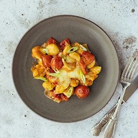 Stoofpotje met gnocchi, tomaat en gepofte paprika Stoofpotje met gnocchi, tomaat en gepofte paprika
